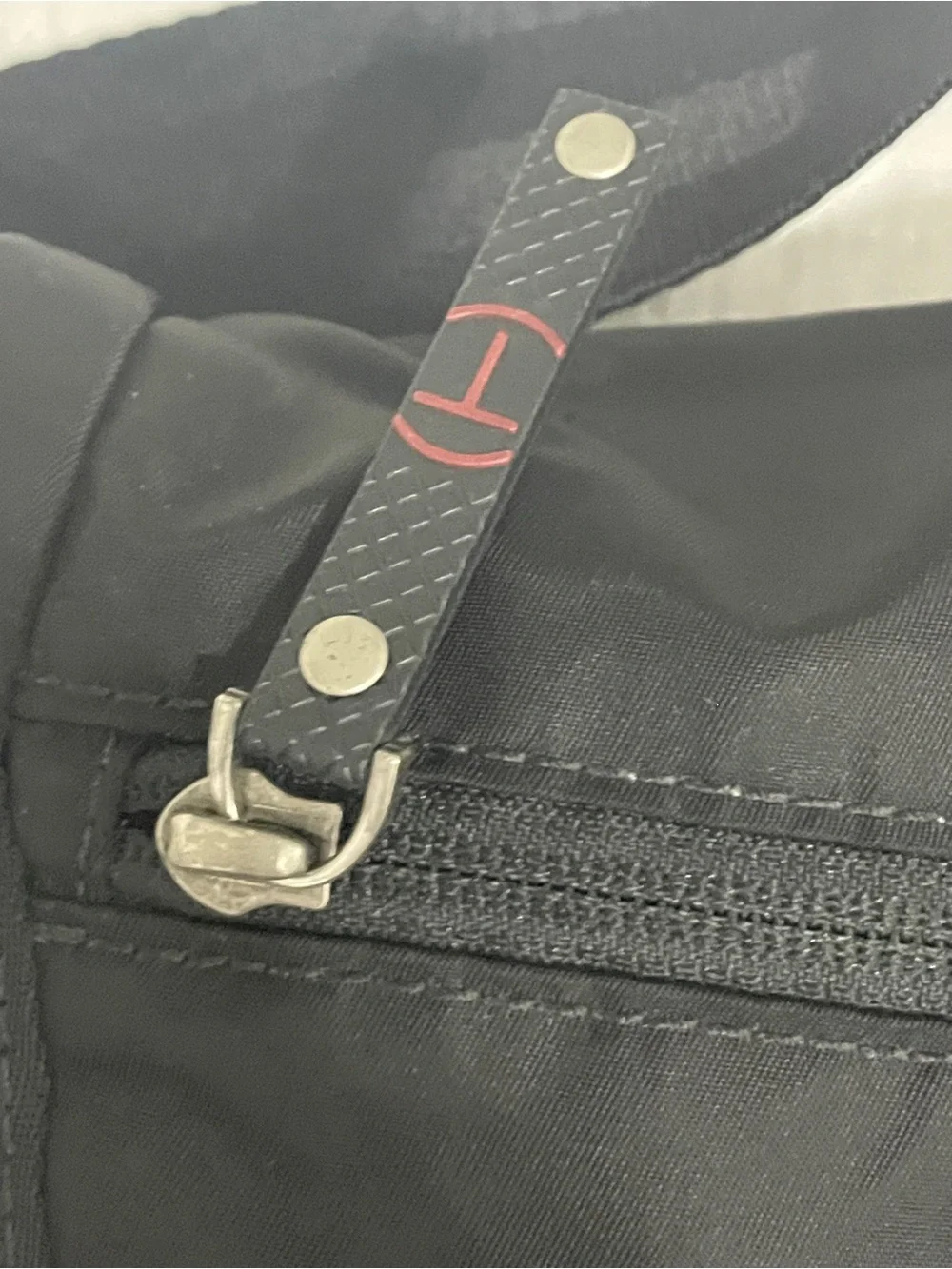Tumi Black Messenger Bag with Red Interior